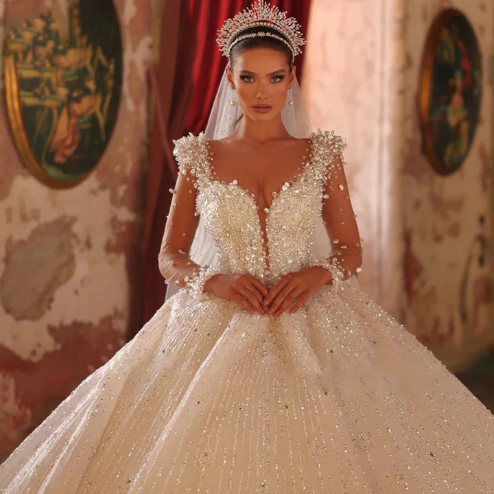 Robe de mariée élégante à manches longues et paillettes