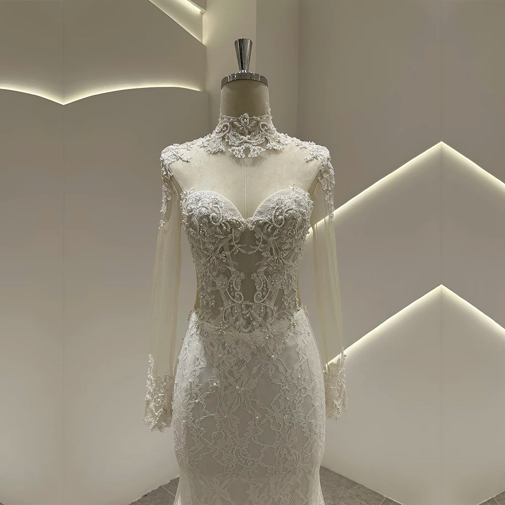 Ivory lace wedding gown with sweetheart neckline, ornate lace bodice, and flared skirt