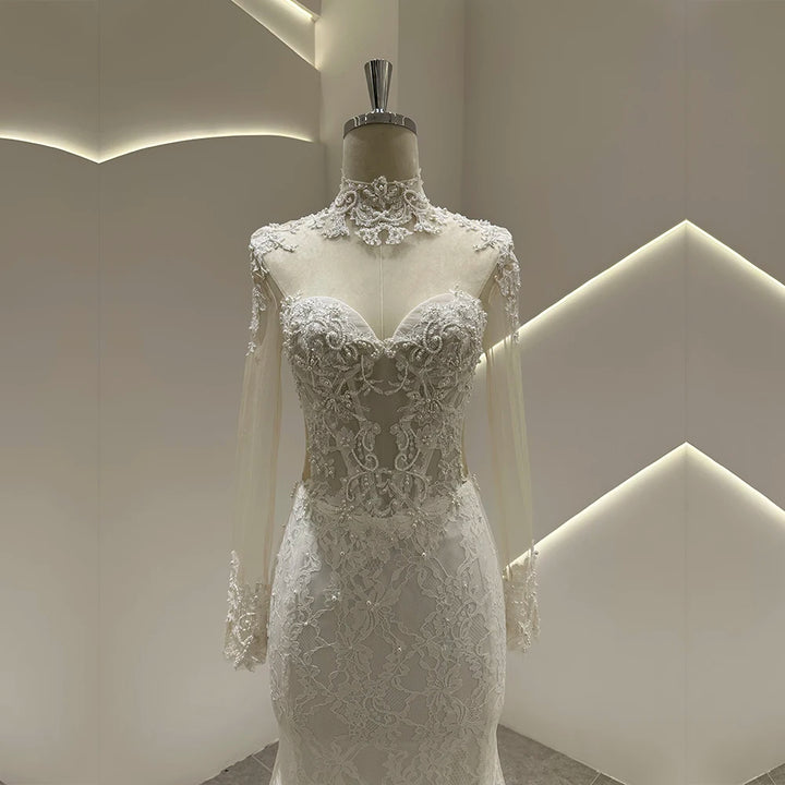 Ivory lace wedding gown with sweetheart neckline, ornate lace bodice, and flared skirt