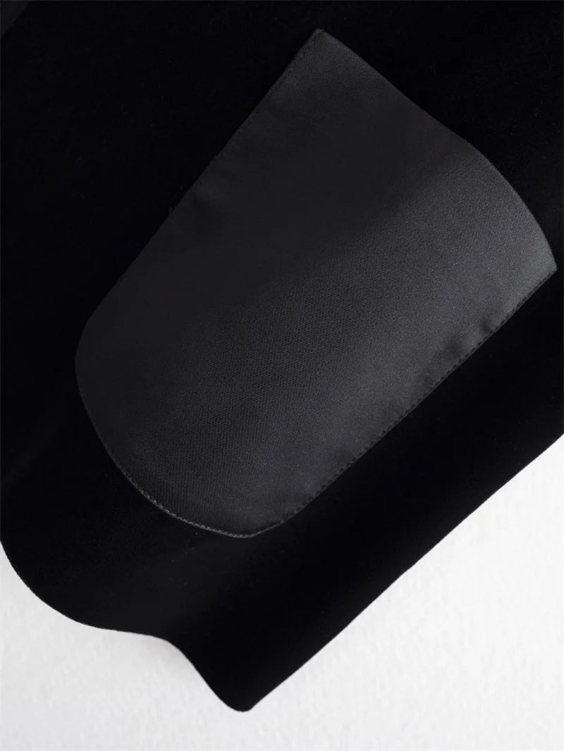 Black vest jacket pocket detail with contrast gray pocket lining