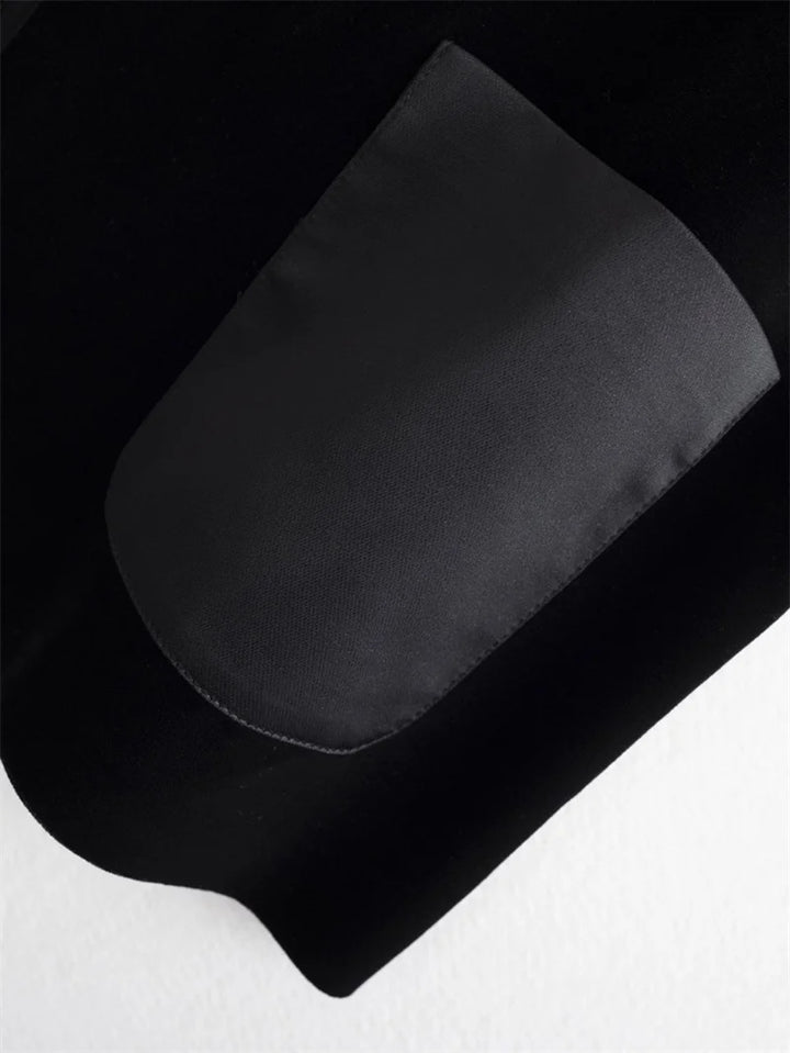 Black vest jacket pocket detail with contrast gray pocket lining
