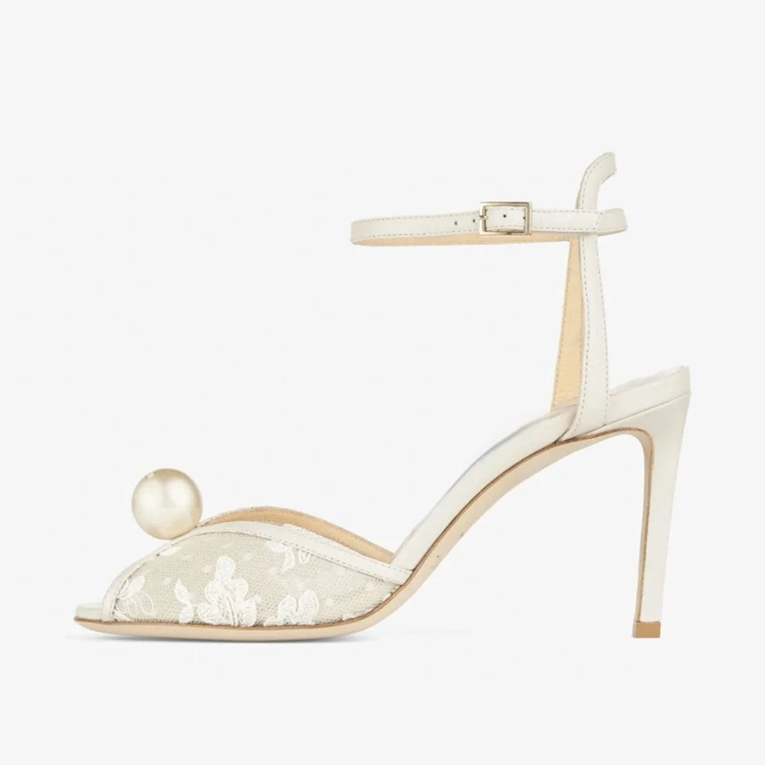 White peep-toe high heel sandal with ankle strap and lace inlay with pearl accent