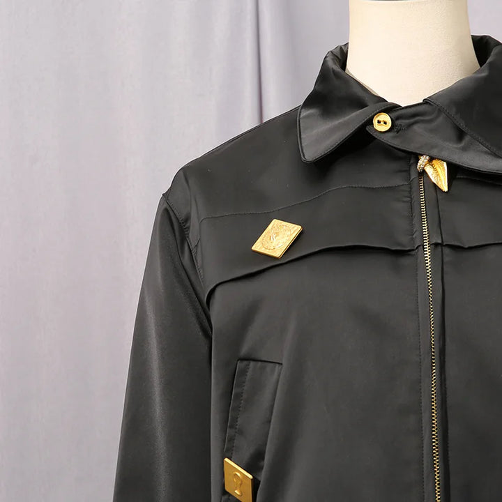 Women’s spliced fashion coat close-up, black, stand collar, gold zipper detail, patch buttons