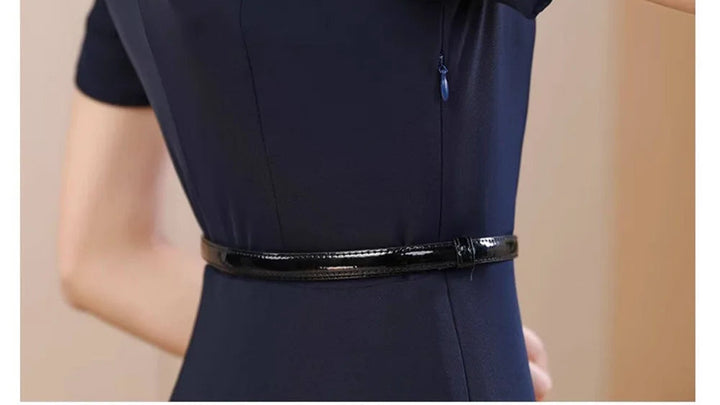 Navy A-line midi dress with waist belt and pleated skirt flare