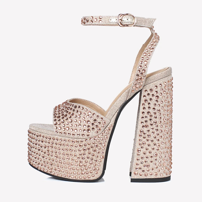 Champagne beige crystal platform sandals with ankle strap and tall block heel, close-up.