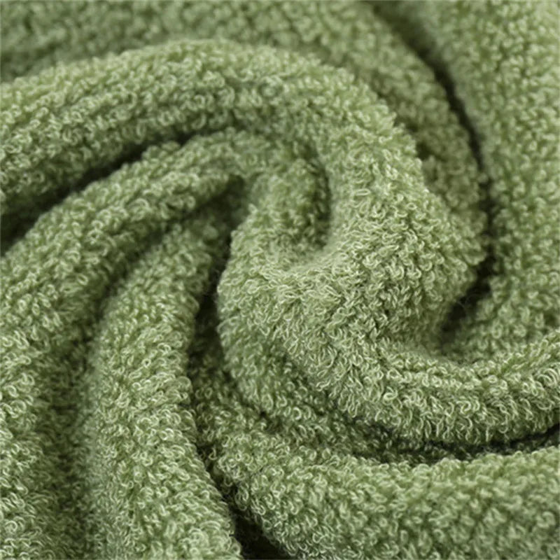 Green terry towel with plush loop pile texture