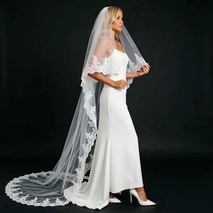 Long bridal veil with lace-trimmed sides, draped veil reaching the floor