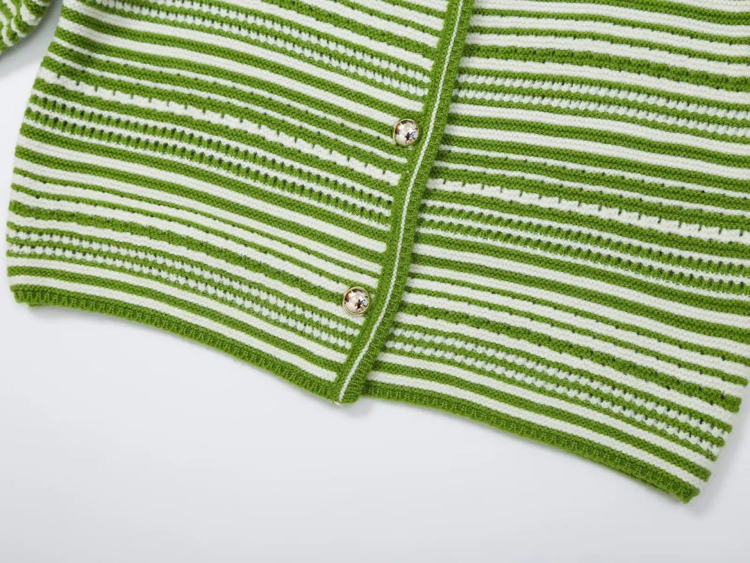 Green and white striped sweater front close-up with button placket and ribbed trim